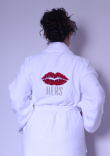 Load image into Gallery viewer, Woman wearing cotton bathrobe with icon of lips on the back. 